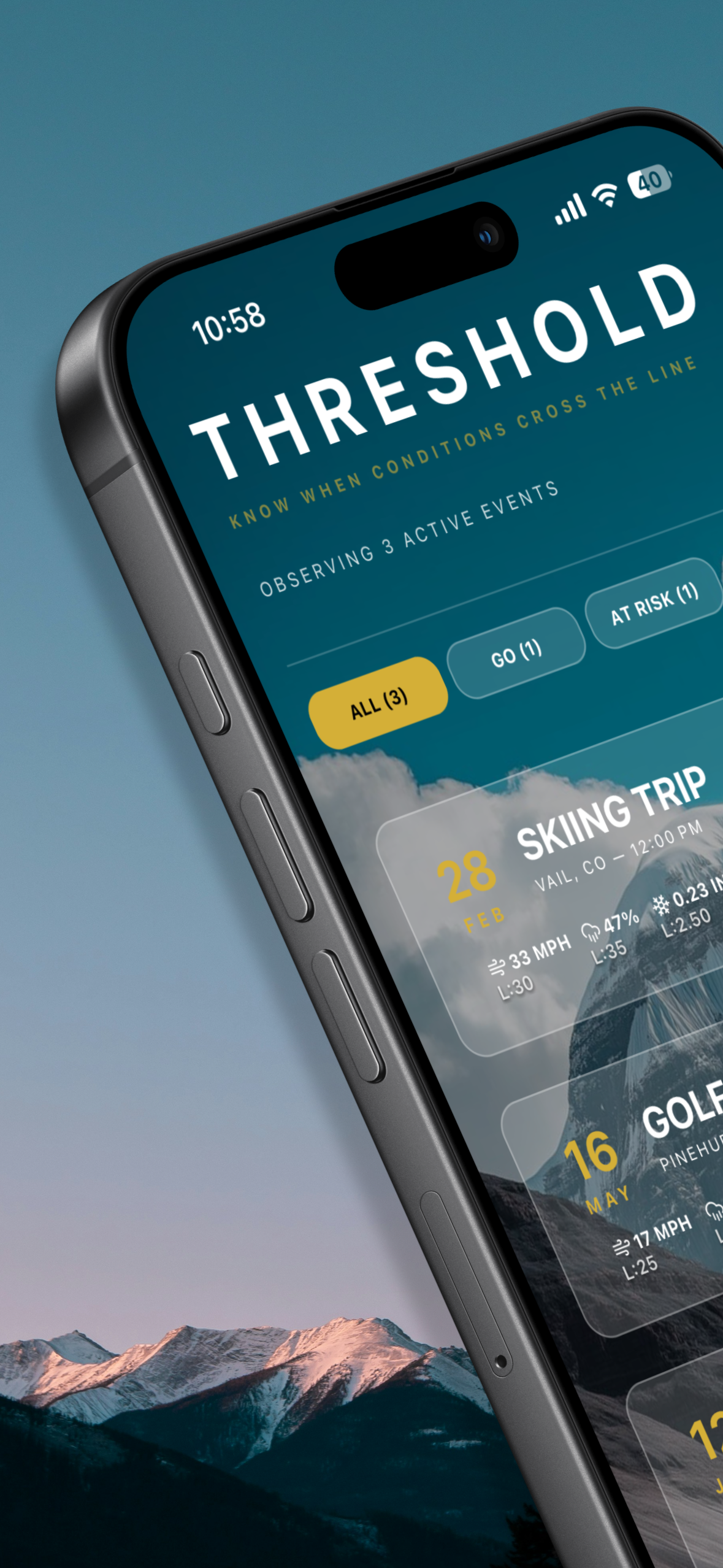 Threshold Weather app showing mountain sunset view with event dashboard
